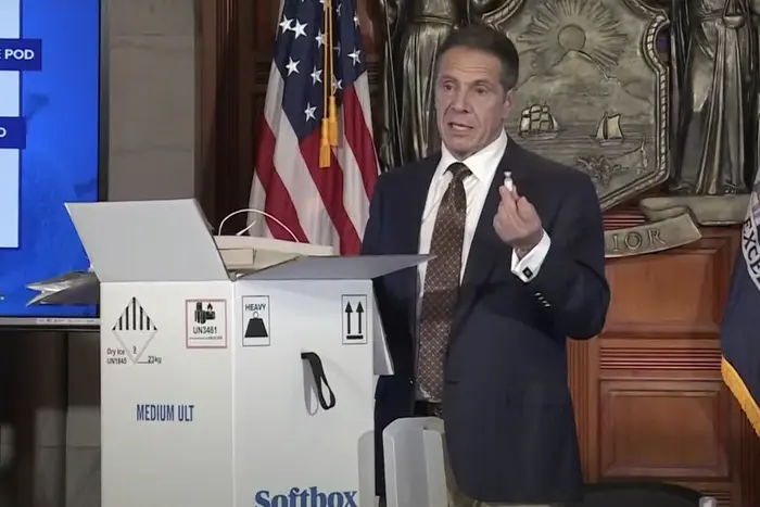 A photo of Gov. Andrew Cuomo showing a fake vial of the vaccine